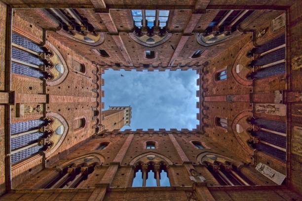 The Palazzo Comunale building in Siena. The Palazzo Comunale building was constructed around 1300, and is used today as the town hall of the city of Siena, Italy. siena italy stock pictures, royalty-free photos & images