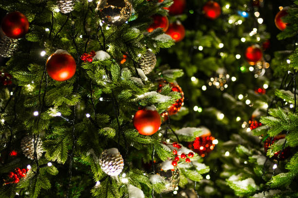 istock Christmas tree decorated by shiny garland and toys 1061432520