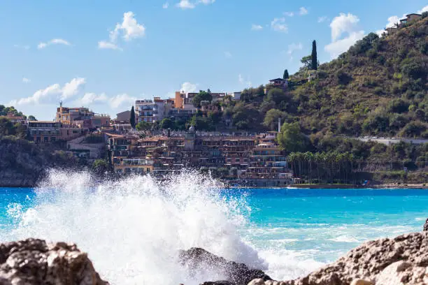 Photo of View from Letojanni to Taormina. Letojanni nestled to the north of Taormina, Letojanni is a popular coastal resort. Sicily, Italy.