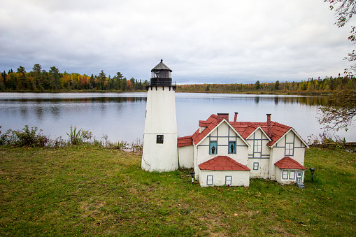 Bay Mills, Michigan, USA - October 14, 2018: Roadside replica of the famous Point Iroquois Lighthouse. The miniature version of the lighthouse is located in the Bay Mills Indian Reservation.