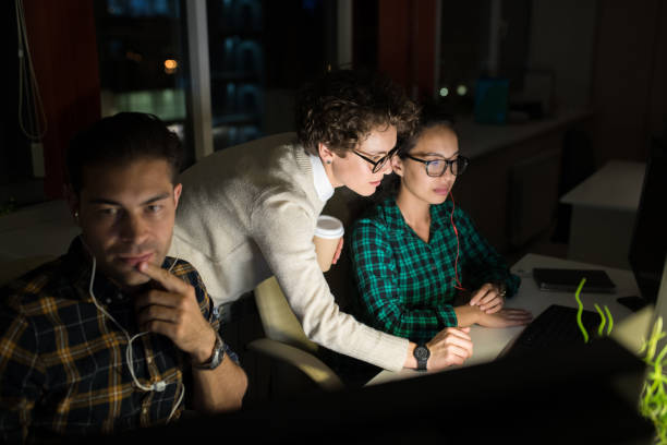istock Group of Entrepreneurs Working at Night 1061442988