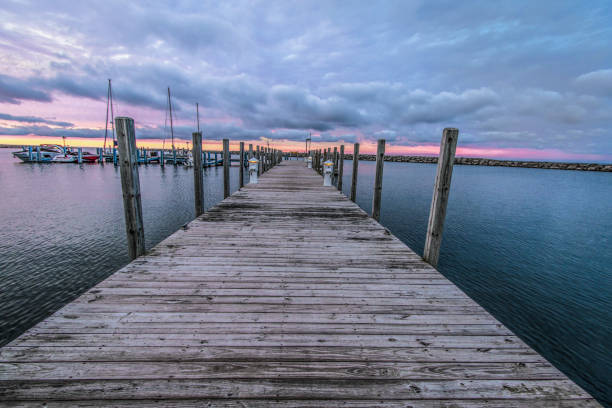 istock Panoramic Summer Background With Wooden Dock Extending Into Lake Huron 1061443022