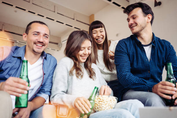 istock Group of friends at home party 1061445378