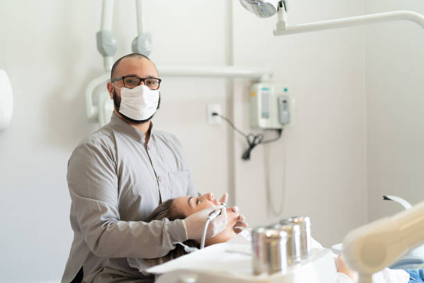 istock Dentist and patient in a dentist office - Portrait 1061445518