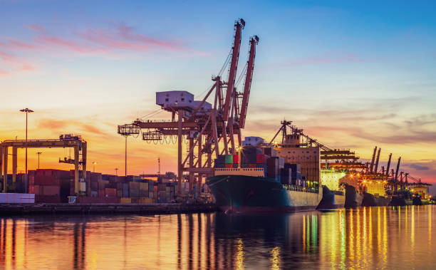 istock Pier port with container Cargo freight ship working crane in shipyard 1061446642