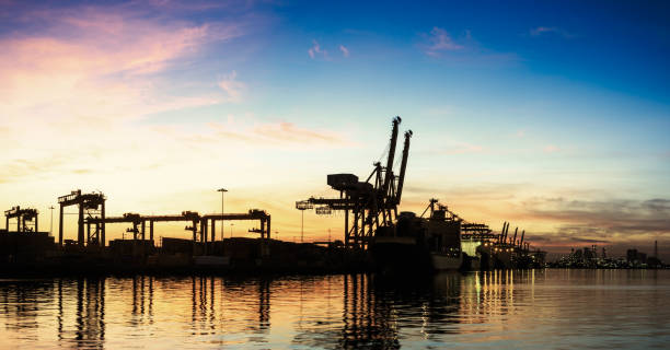 istock Pier port with container Cargo freight ship working crane in shipyard 1061446656