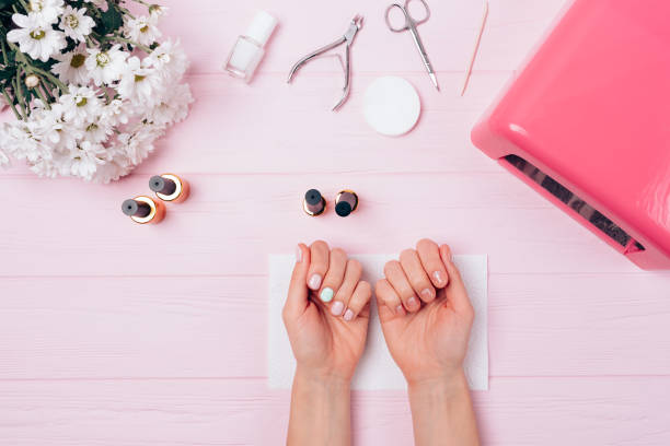 istock Flatlay of female hands with shellac covering 1061447824