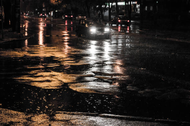 istock The night city road traffic under rain. 1061452092