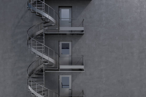 istock Gray building with spiral fire escape stairs 1061452238