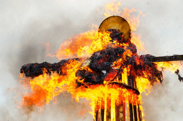 Burning down scarecrow of Shrovetide in bright flame