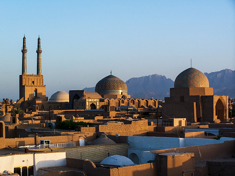 A view over the desert city of Yazd, Iran, at sunset.