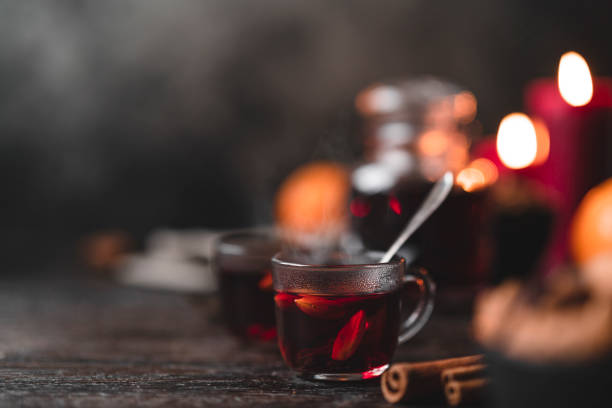 Traditional Swedish glögg mulled wine at Christmas The traditional Swedish mulled wine drink known as glögg, on a wooden table at Christmas. mulled wine stock pictures, royalty-free photos & images