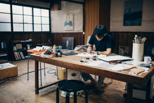 istock Mature male artist sketching ideas in his studio 1061468498