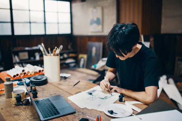 istock Mature male artist sketching ideas in his studio 1061468516