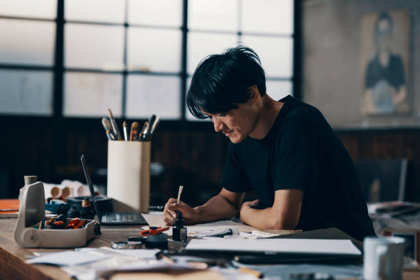 istock Mature male artist sketching ideas in his studio 1061468540