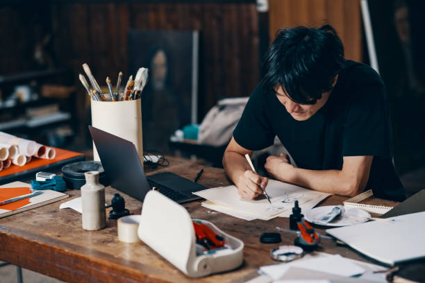 istock Mature male artist sketching ideas in his studio 1061468544