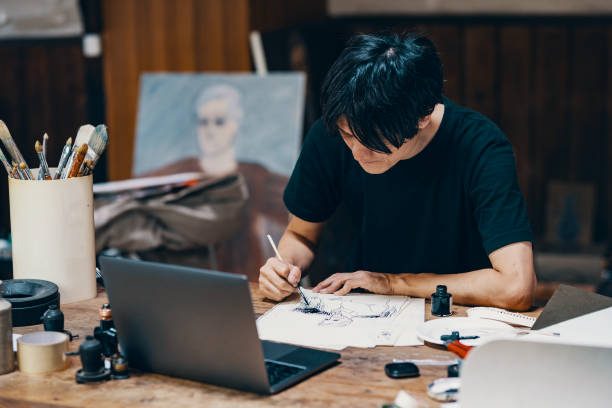 istock Mature male artist sketching ideas in his studio 1061468552