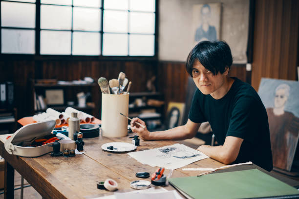 istock Mature male artist sketching ideas in his studio 1061468568