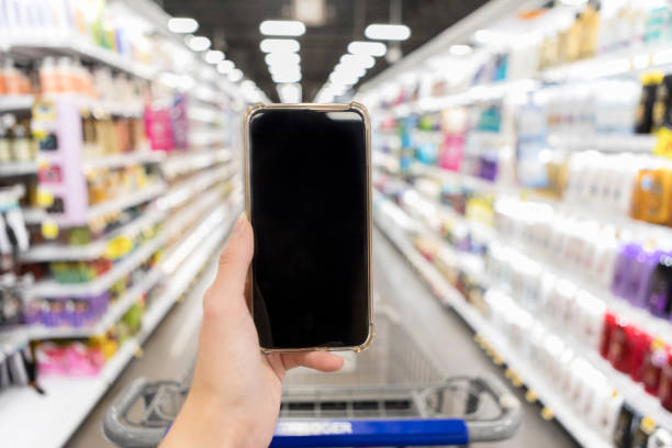 istock Unrecognizable woman holds smartphone to use her mobile store app 1061473952