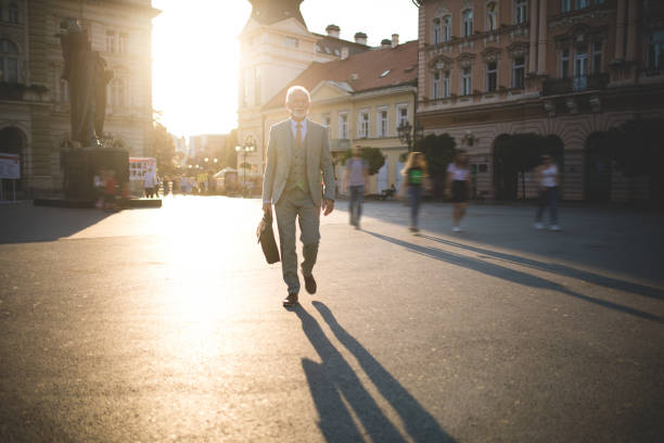 istock Senior entrepreneur businessman going to work 1061475810