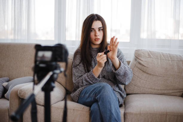 istock Young vlogger recording a make-up video for vlog 1061477270