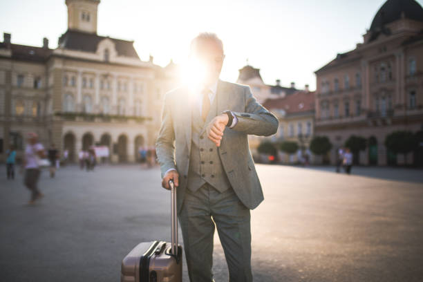 istock Senior businessman looking at a time on his watch 1061477948
