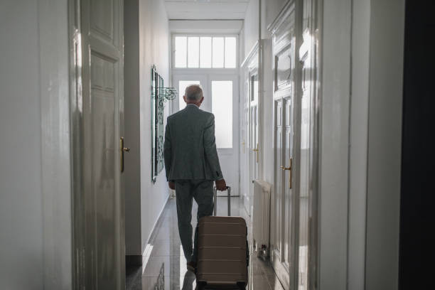 istock Business with a suitcase leaving the apartment 1061479530