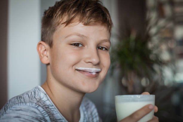istock Boy Enjoying a Glass of Yogurt 1061486202