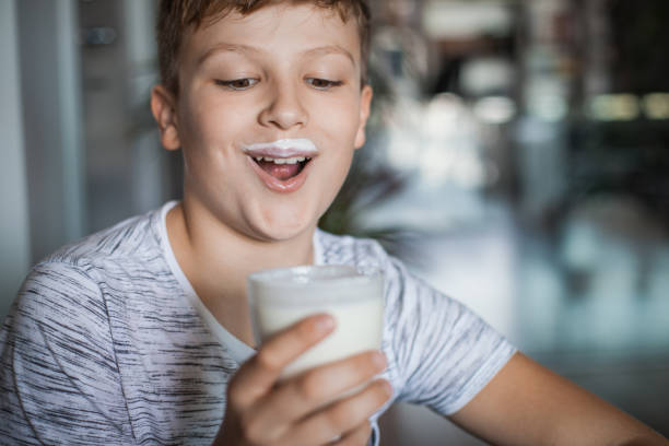 istock Boy Enjoying a Glass of Yogurt 1061486236