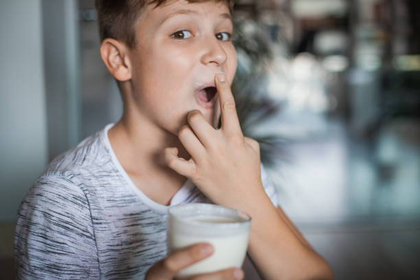istock Boy Enjoying a Glass of Yogurt 1061486238