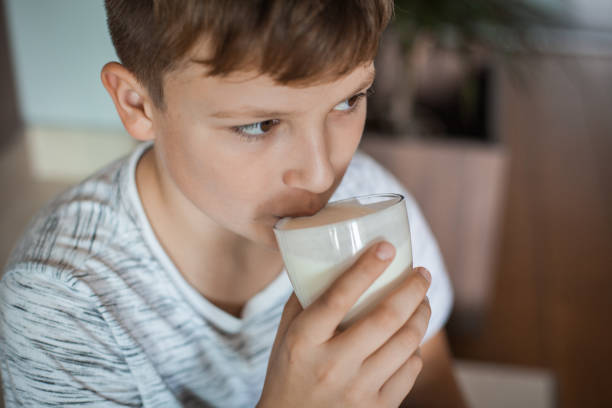 istock Boy Enjoying a Glass of Yogurt 1061486244