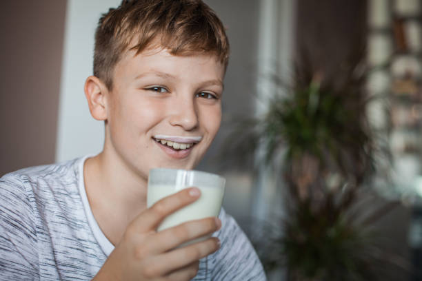 istock Boy Enjoying a Glass of Yogurt 1061486260