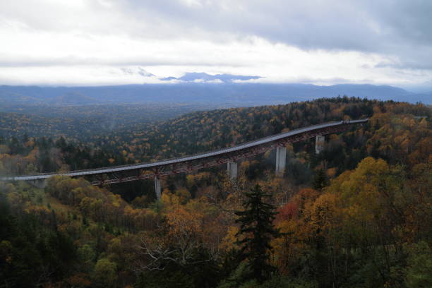 Autumn picture of Mikuni Pass, Hokkaido, Japan Extremely beautiful during autumn time when you see red, yellow, green, brown come together to form a picturesque view. mikuni pass stock pictures, royalty-free photos & images