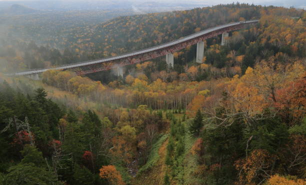 Autumn picture of Mikuni Pass, Hokkaido, Japan Extremely beautiful during autumn time when you see red, yellow, green, brown come together to form a picturesque view. mikuni pass stock pictures, royalty-free photos & images