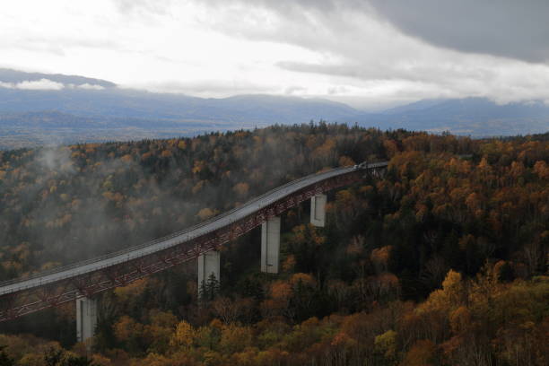 Autumn picture of Mikuni Pass, Hokkaido, Japan Extremely beautiful during autumn time when you see red, yellow, green, brown come together to form a picturesque view. mikuni pass stock pictures, royalty-free photos & images