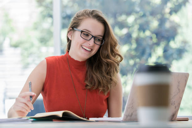 istock Happy young female entrepreneur working in bright office 1061495106