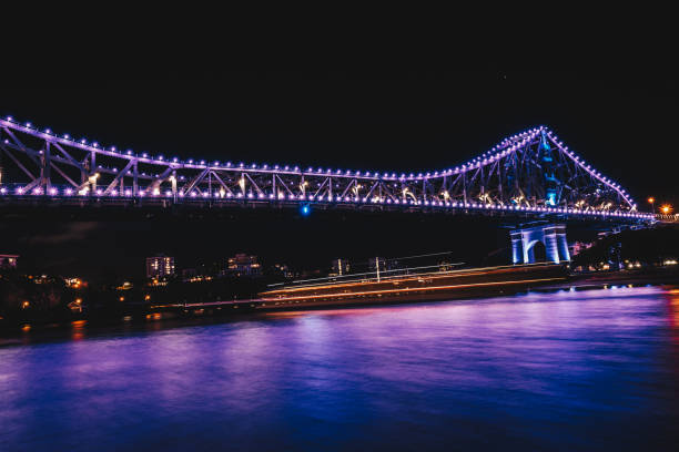 istock Reflection of illuminated bridge in water 1061497554