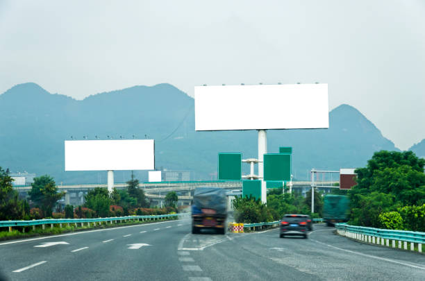 istock Blank billboard on blue sky background for new advertisement 1061501424