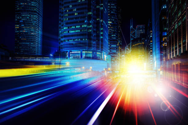 istock City night view with moving traffic light trails. double exposure 1061501726