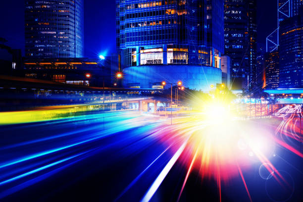 istock City night view with moving traffic light trails. double exposure 1061501728