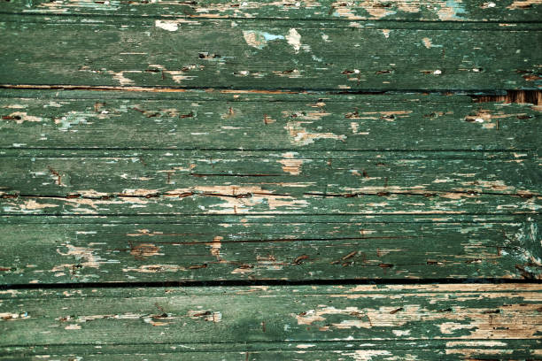 istock Texture of cracked painted peeling wooden background. 1061502056