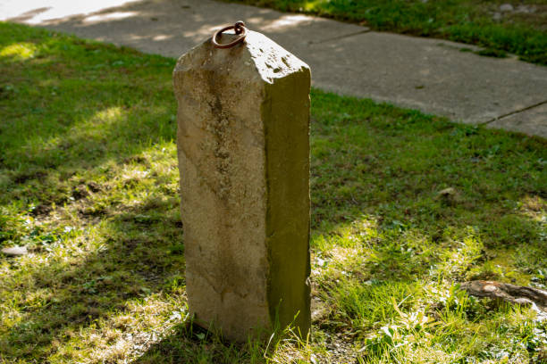 istock Isolated stone hitching post in small town 1061506738