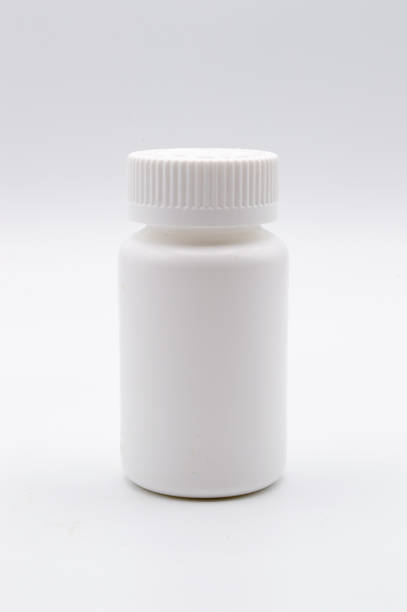 istock Blank empty white medicine bottle isolated on white background 1061512556