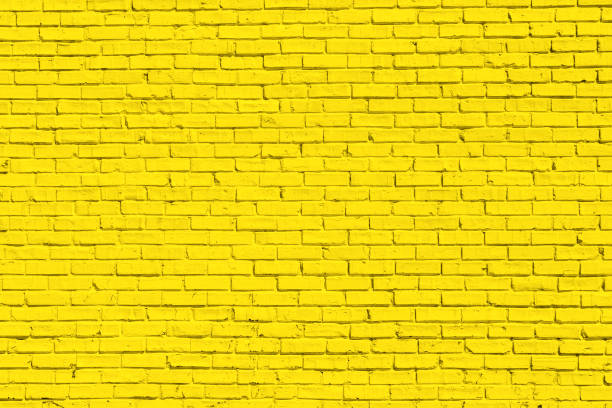 Yellow brick wall for background or texture stock photo