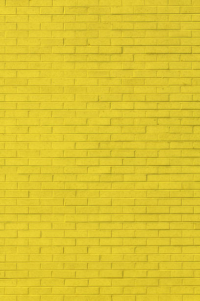 Yellow brick wall texture stock photo