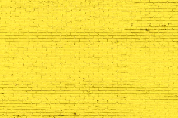 istock Yellow misty brick wall for background or texture 1061520312