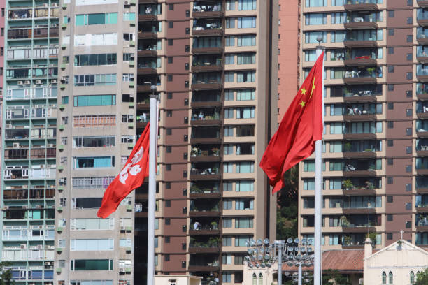 istock a HK and China flag with business office tower 1061528786