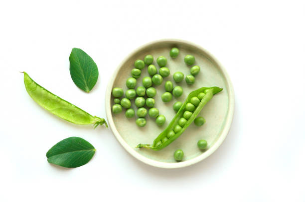Isolated green peas on plate. stock photo