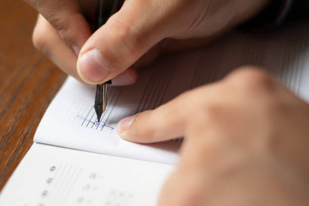 istock close up student hands write down music notes on class in school f 1061532860