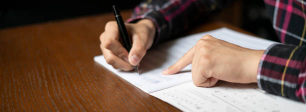istock close up student hands write down music notes on class in school f 1061532888
